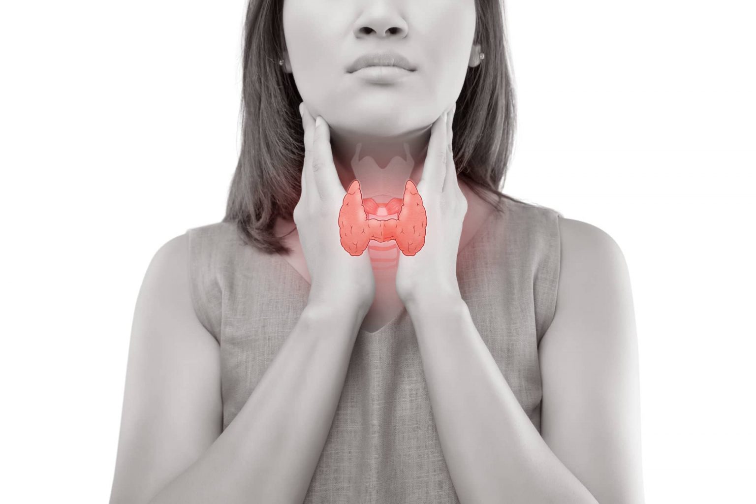 Woman holding her throat with a diagram of a thyroid.