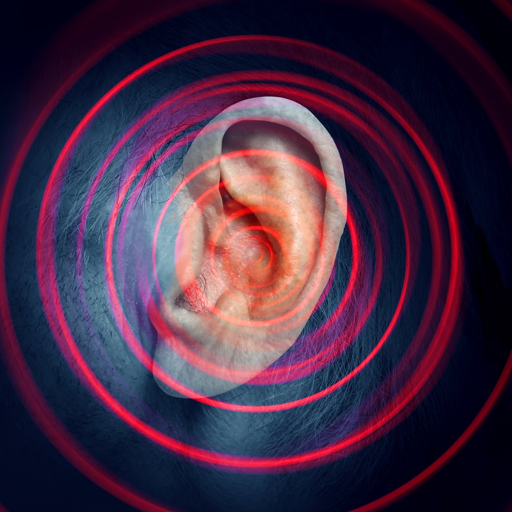 Close-up ear photo with circling red rings, tinnitus concept.