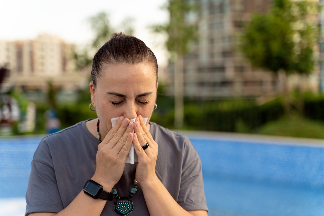 Woman blows nose