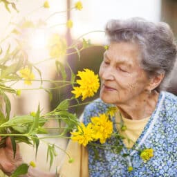 Woman smelling flowers